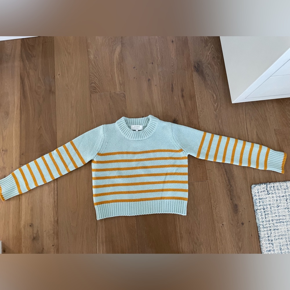 La Ligne mini Marin sweater in blue with gold stripes.